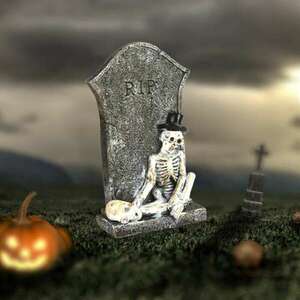 Csontvázak a sírkőnél kép