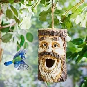 Fa madárházikóval és arccal kép
